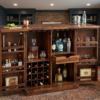 Solid wood expandable home bar cabinet with wine rack and door storage shelving in a modern living room setting.